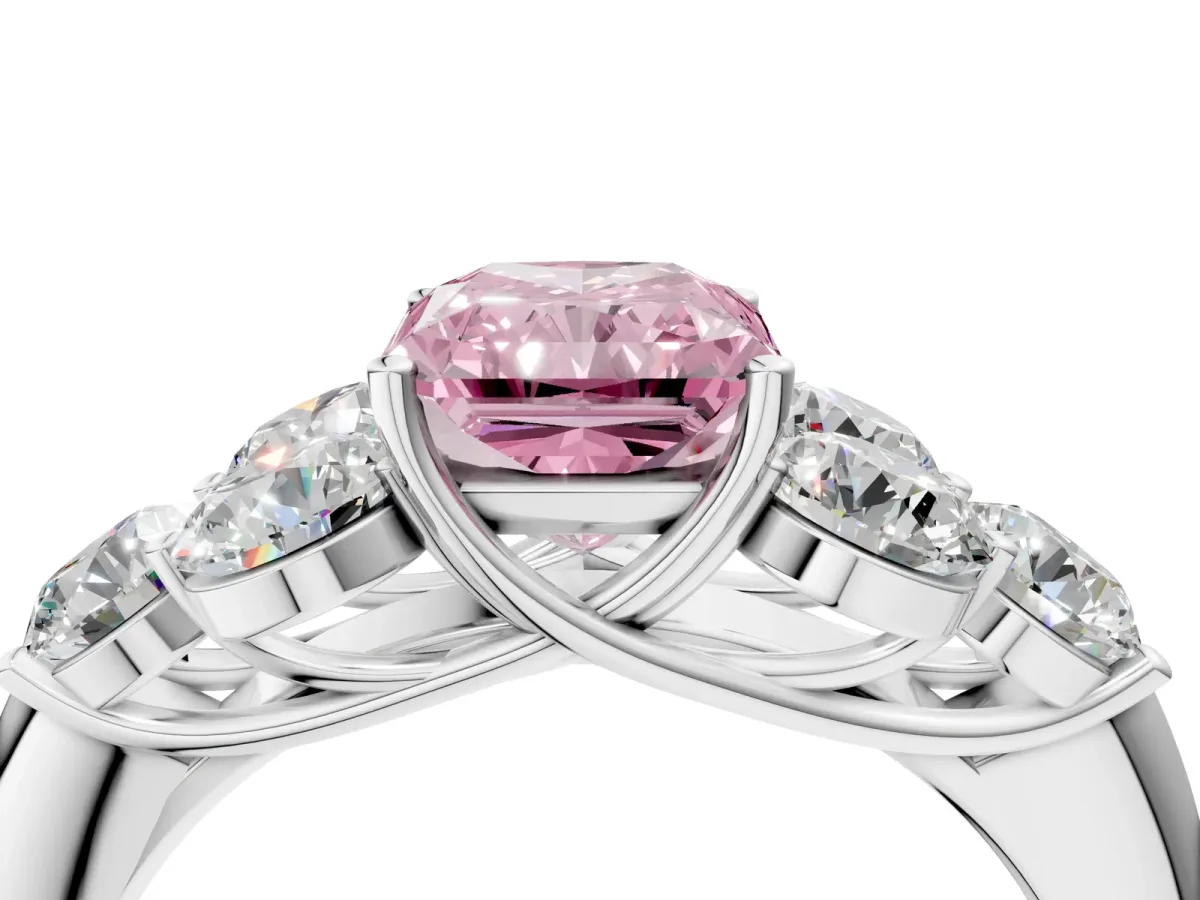 Fancy Pink Radiant Cut Cut Diamond Cluster Ring with Round Accent Stones and Prong Setting on a Classic Band Platinum