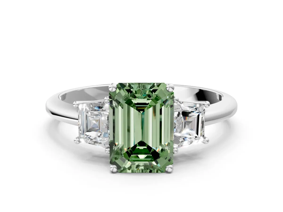 Fancy Green Emerald Cut Diamond Three-Stone Ring with Trapezoid Side Stones and Prong Setting White gold