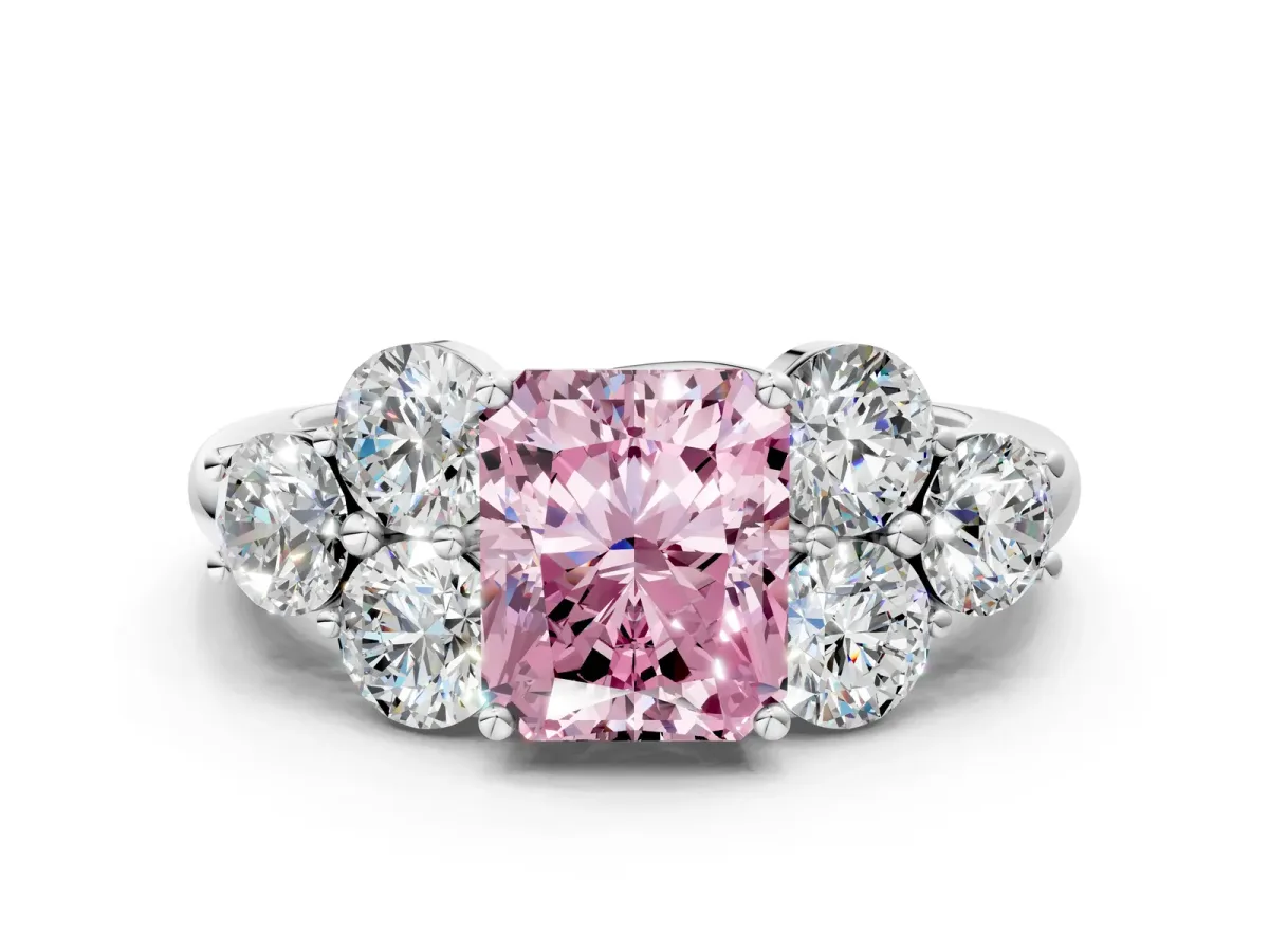 Fancy Pink Radiant Cut Cut Diamond Cluster Ring with Round Accent Stones and Prong Setting on a Classic Band Platinum