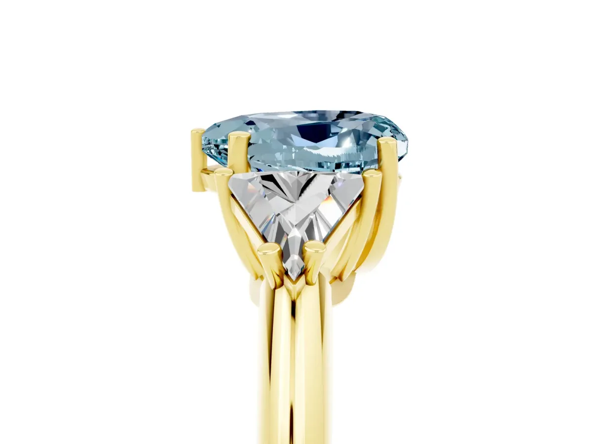 Three-Stone Heart Cut Aquamarine Engagement Ring with Trillion Side Stones and Prong Setting Yellow gold