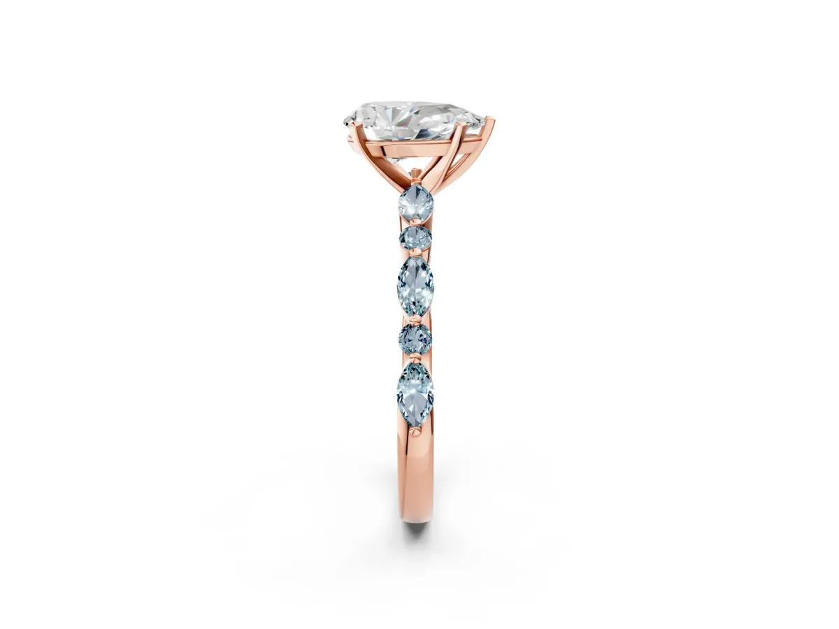 Pear Cut Diamond Ring with Marquise and Round Aquamarine Side Stones and Four-Prong Setting Rose gold