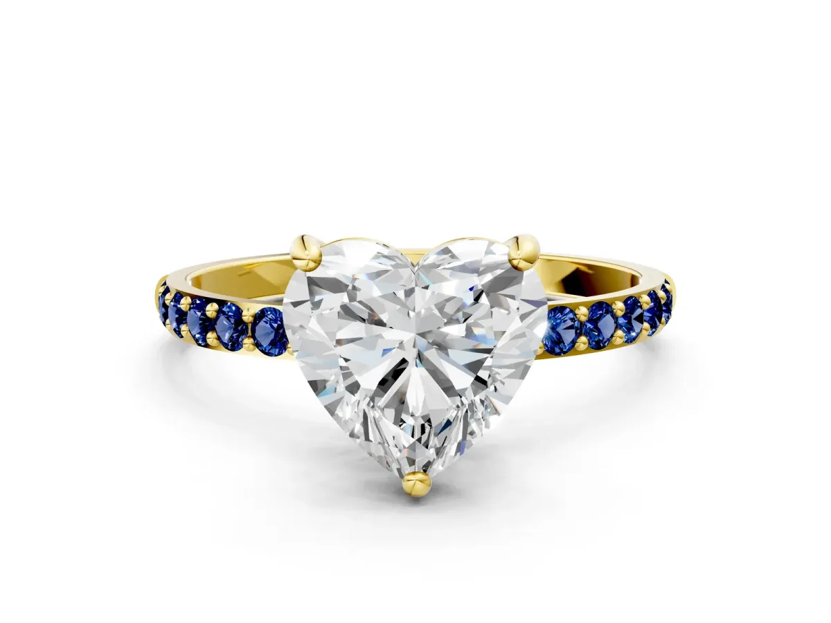 Heart Cut Diamond Solitaire Ring with Round Blue Sapphire Pavé Band and Prong Setting Yellow gold