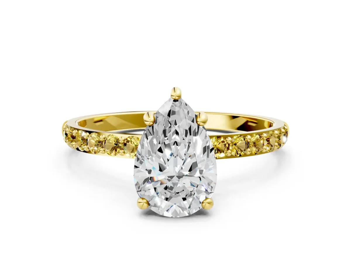 Pear Cut Diamond Solitaire Ring with Round Yellow Sapphire Pavé Band and Prong Setting Yellow gold