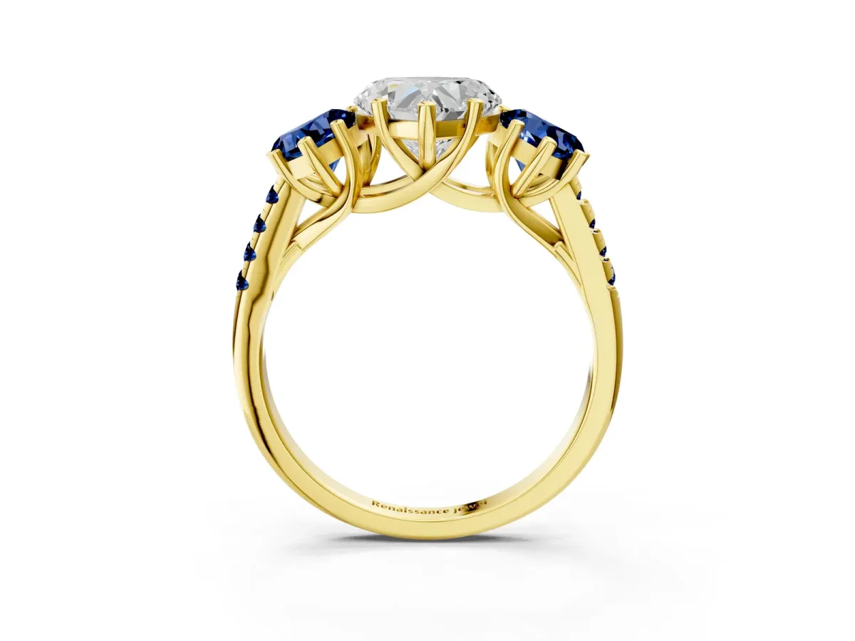 Three-Stone Heart Cut Diamond Ring with Round Blue Sapphire Pavé Band and Prong Setting Yellow gold
