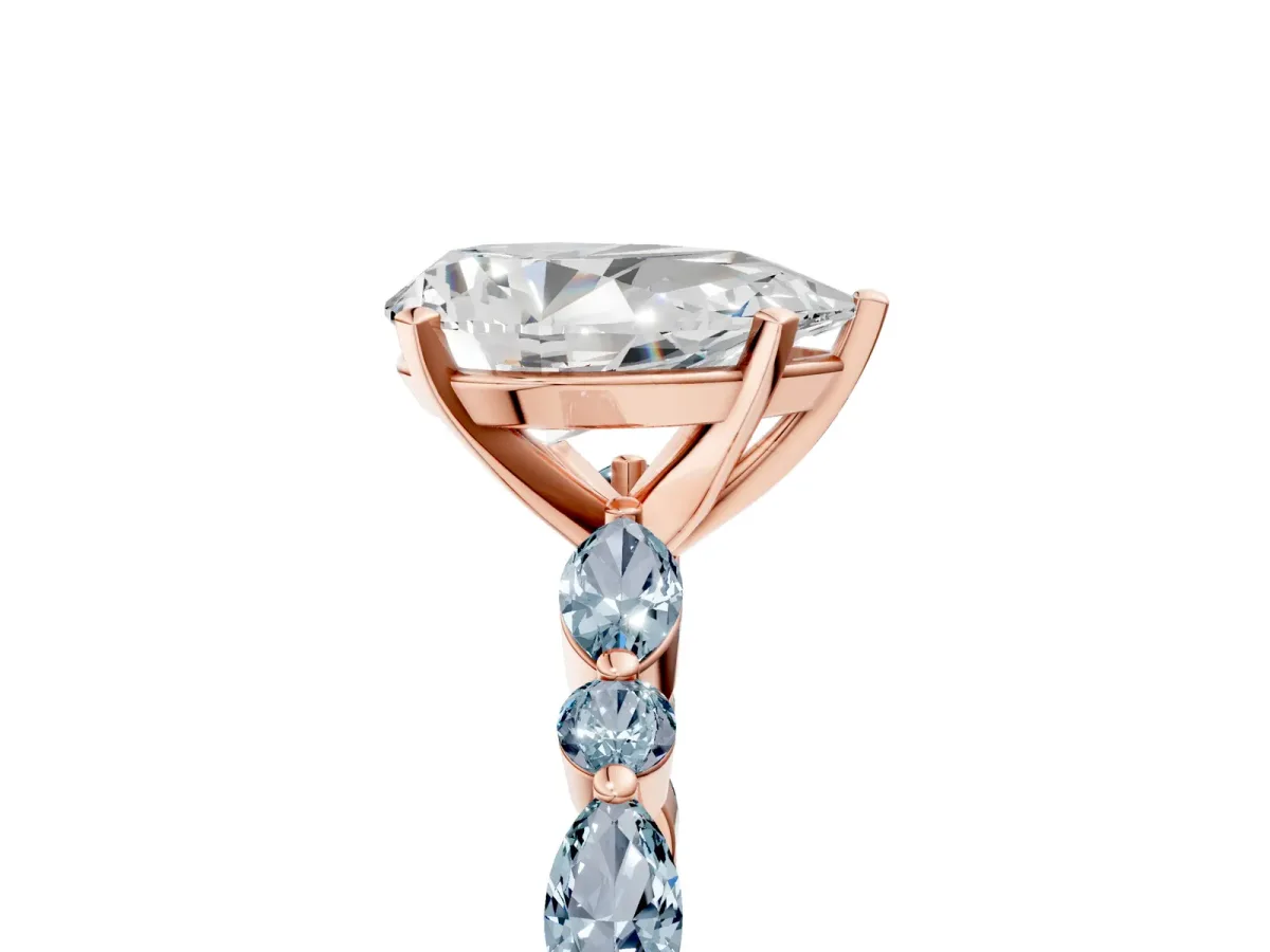Pear Cut Diamond Ring with Marquise and Round Aquamarine Side Stones and Four-Prong Setting Rose gold