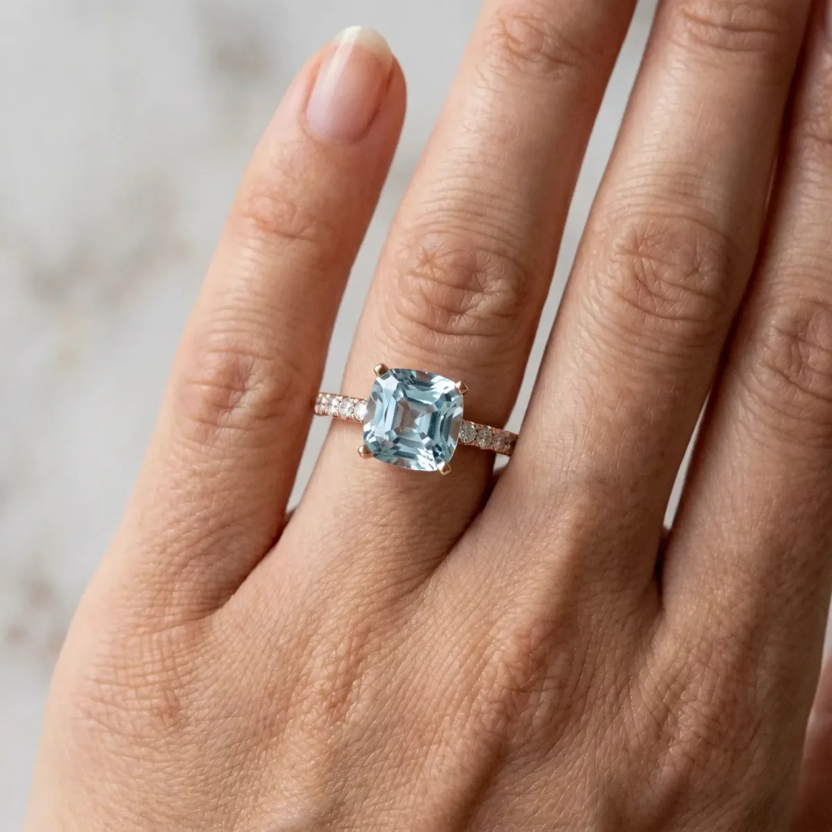Cushion Cut Aquamarine Solitaire Ring with Round Pavé Band and Four-Prong Setting Rose gold