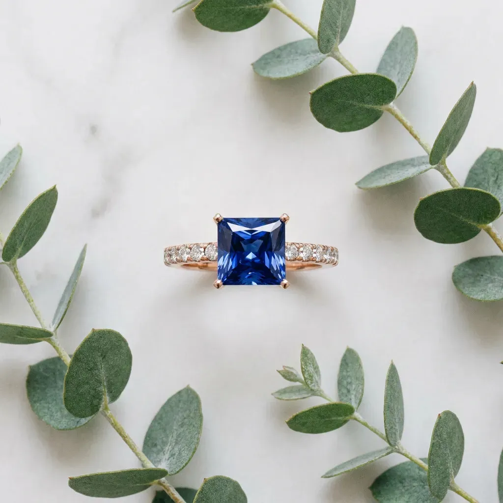 Princess Cut Blue Sapphire Solitaire Ring with Round Pavé Band and Four-Prong Setting Rose gold
