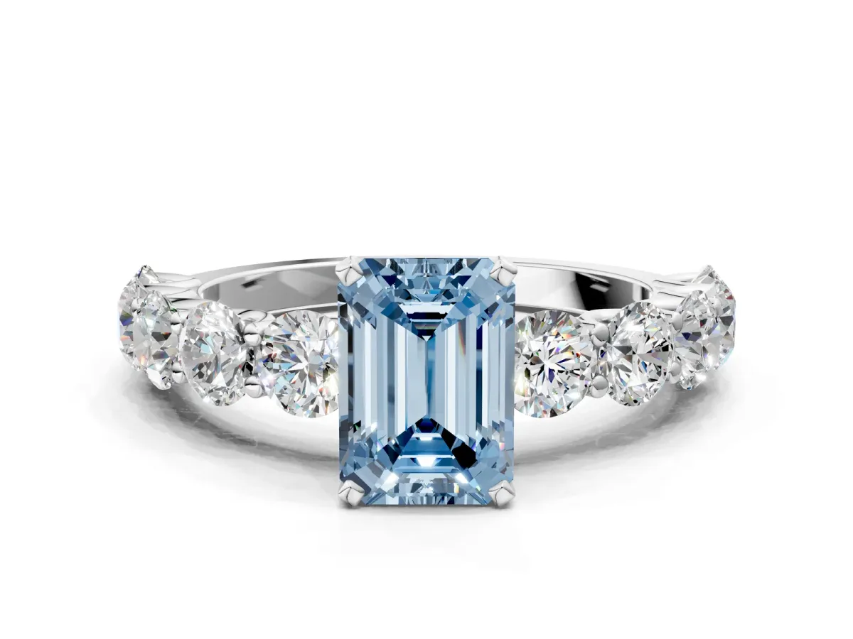 Fancy Blue Emerald Cut Diamond Prong Setting with Side Stones on a Pave Band Silver