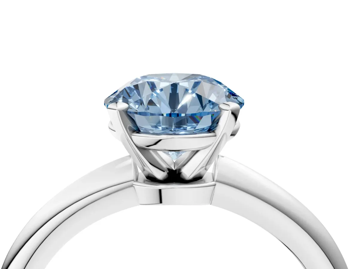 Fancy Blue Round Cut Diamond Solitaire Ring with Six-Prong Setting and Classic Band Platinum