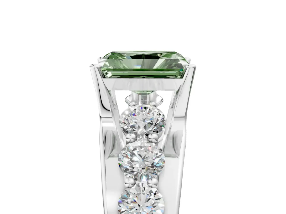 Fancy Green Radiant Cut Brilliant Solitaire with Side Stones on a Pave Band and Four-Prong Setting Platinum