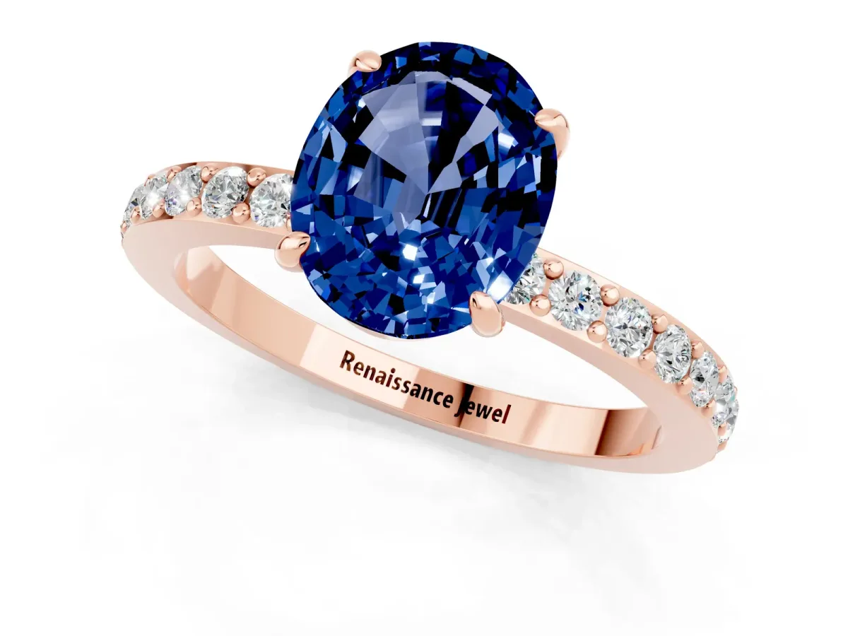 Oval Cut Blue Sapphire Solitaire Engagement Ring with Pavé Band and Four-Prong Setting Rose gold