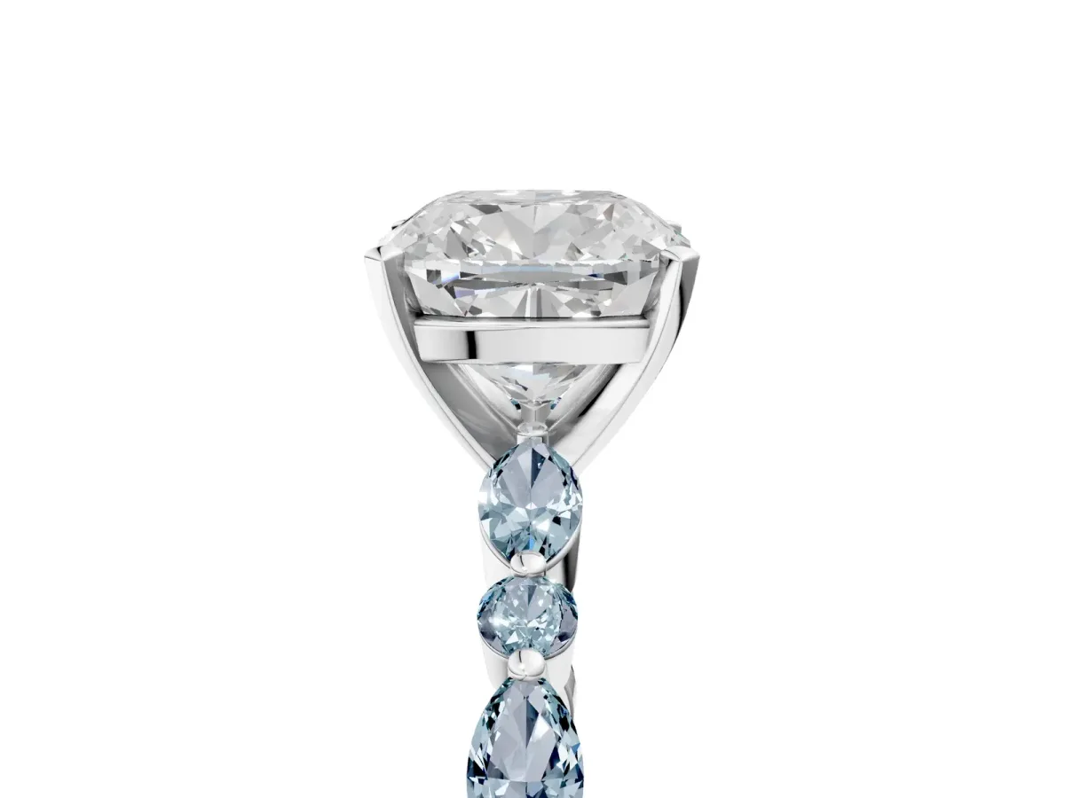 Cushion Cut Diamond Ring with Marquise and Round Aquamarine Side Stones and Four-Prong Setting Platinum
