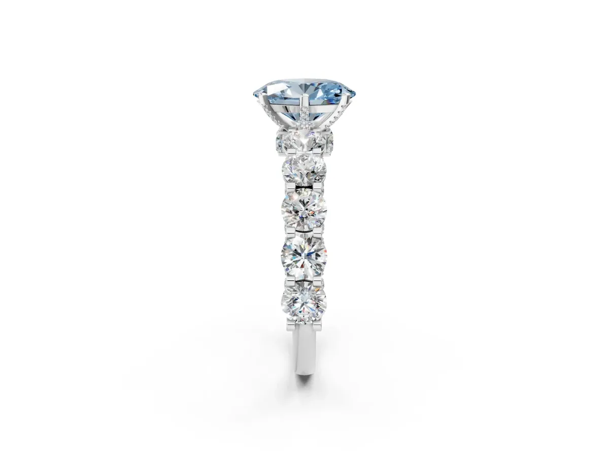 Fancy Blue Oval Cut Diamond Side Stone Engagement Ring with Four-Prong Setting White gold