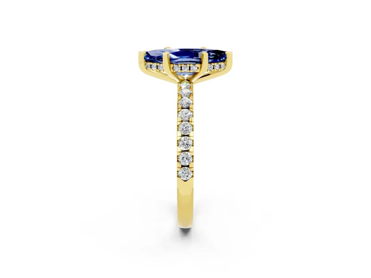 Marquise Cut Blue Sapphire Solitaire Ring with Round Pavé Band and Four-Prong Setting Yellow gold