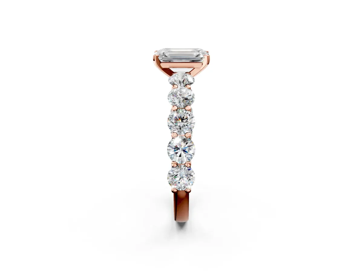 Emerald Cut Diamond Prong Setting with Side Stones on a Pave Band Rose gold