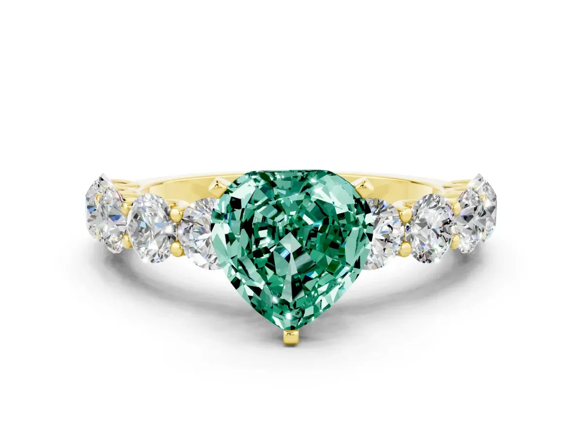 Heart Cut Green Sapphire Prong Setting with Side Stones on a Pave Band Yellow gold