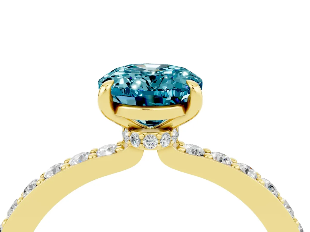 Oval Cut Blue Topaz Solitaire Engagement Ring with Pavé Band and Four-Prong Setting Yellow gold