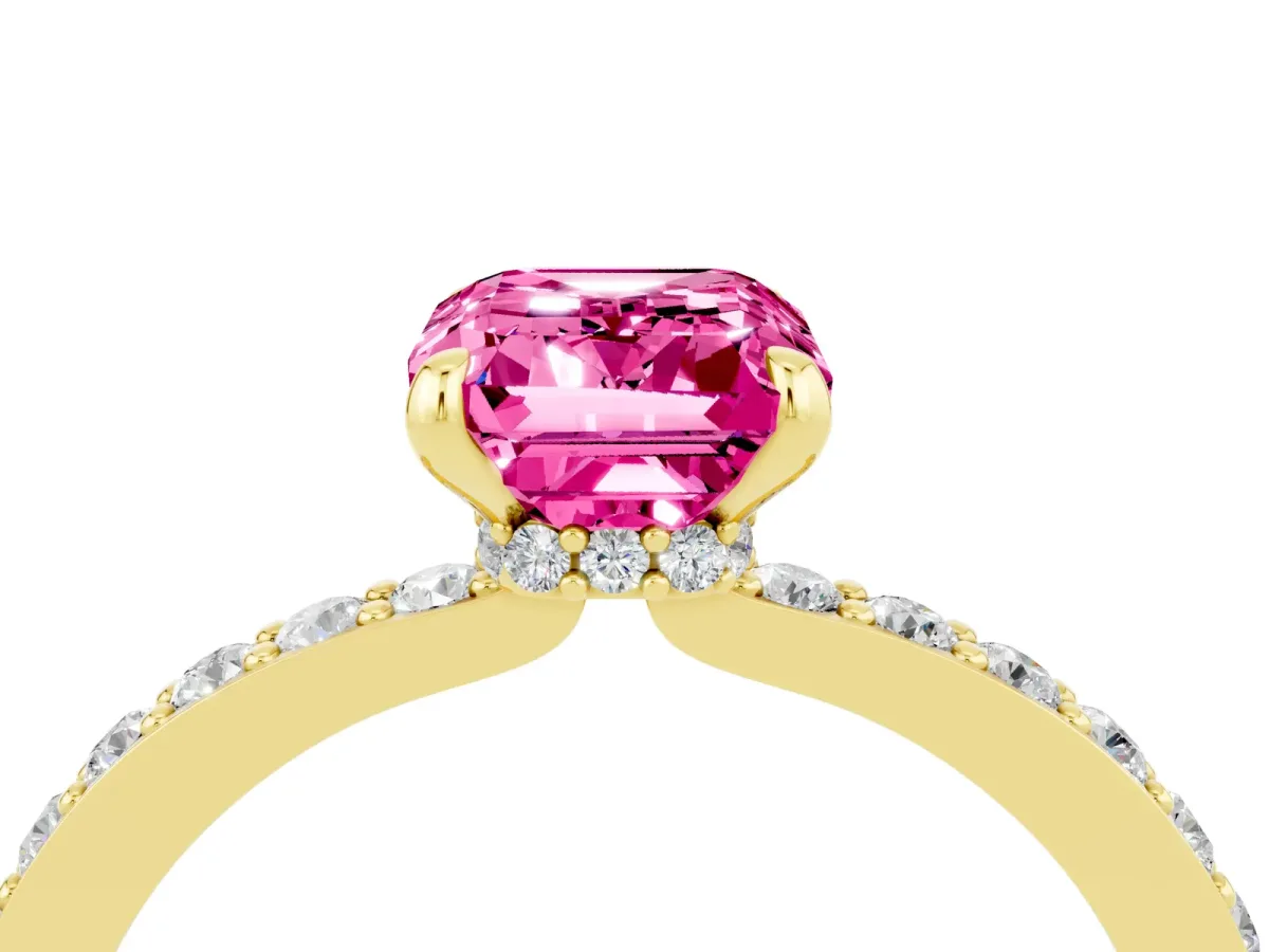 Emerald Cut Pink Sapphire Solitaire Engagement Ring with Pavé Band and Four-Prong Setting Yellow gold