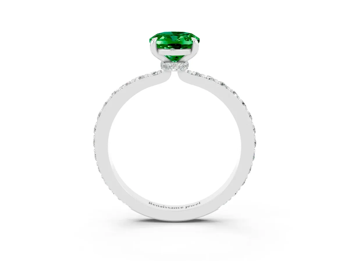 Oval Cut Emerald Solitaire Engagement Ring with Pavé Band and Four-Prong Setting Silver