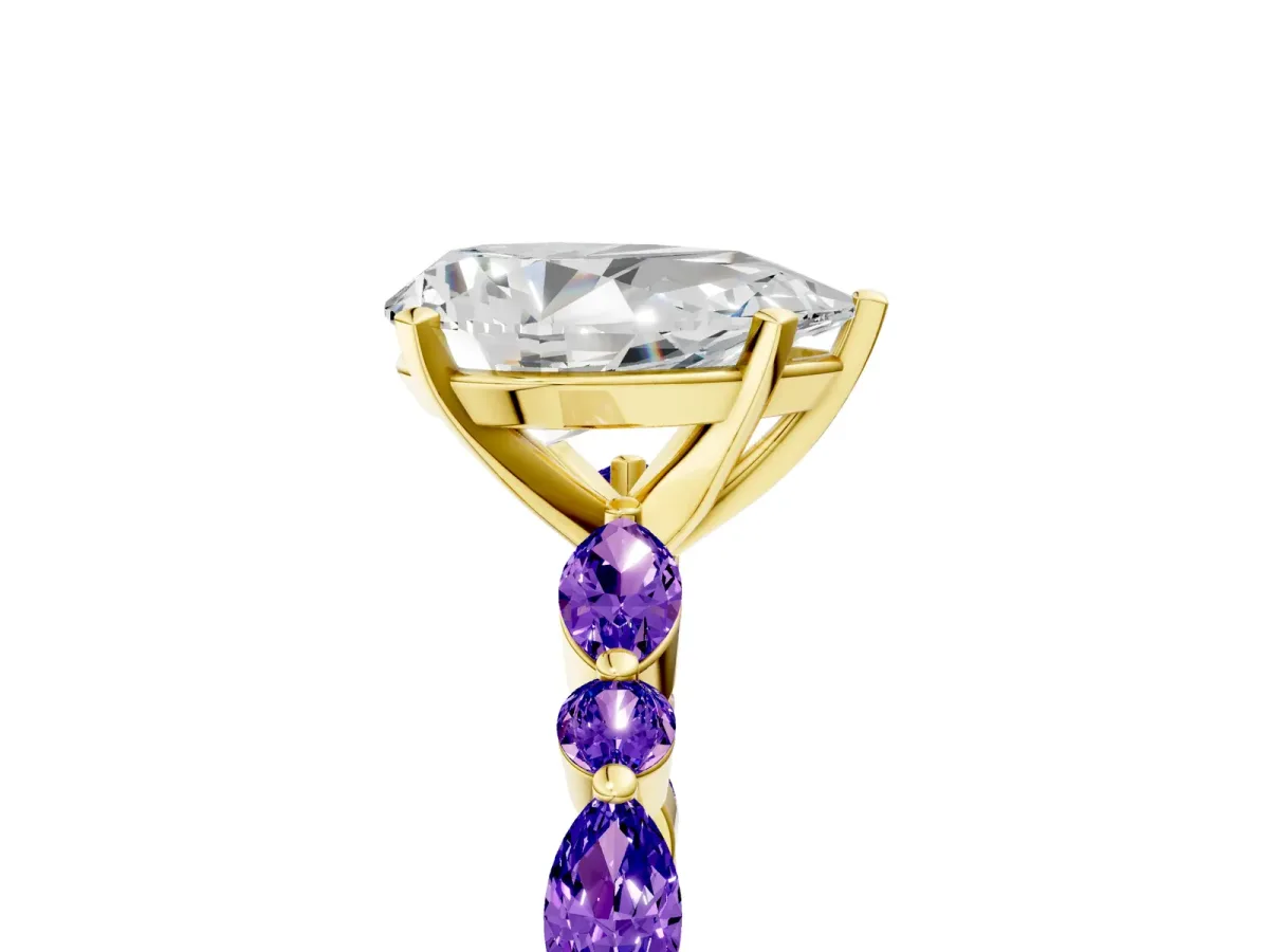 Pear Cut Diamond Ring with Marquise and Round Tanzanite Side Stones and Four-Prong Setting Yellow gold