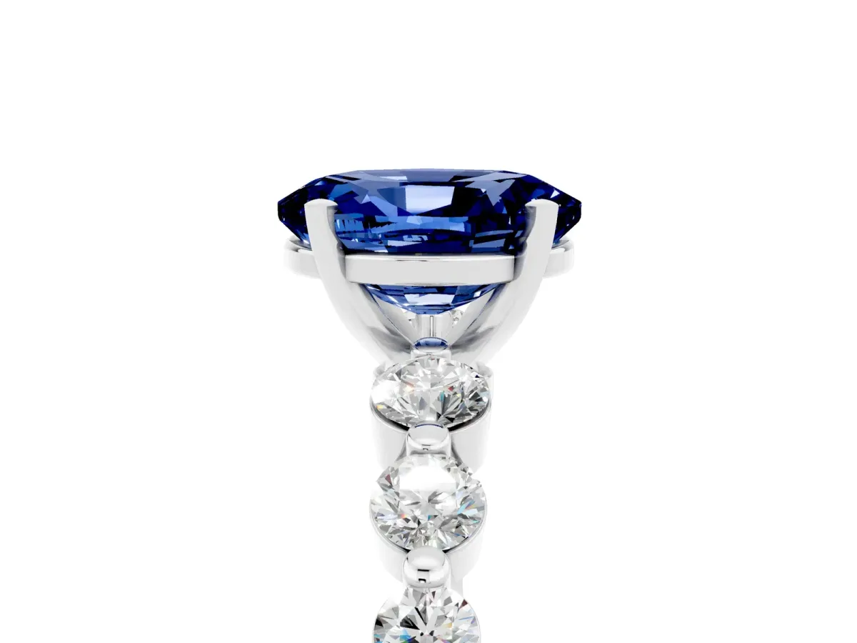 Oval Cut Solitaire Blue Sapphire Ring with Pave Band and Four-Prong Setting Platinum