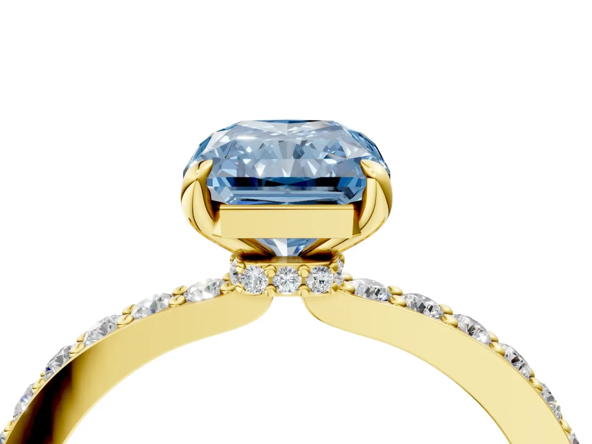 Fancy Blue Radiant Cut Diamond Solitaire Engagement Ring with Pavé Band and Four-Prong Setting Yellow gold