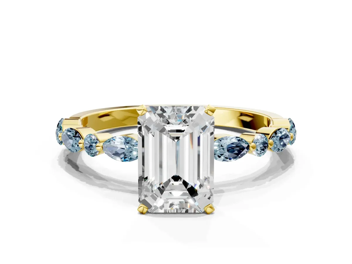 Emerald Cut Diamond Ring with Marquise and Round Aquamarine Side Stones and Four-Prong Setting Yellow gold