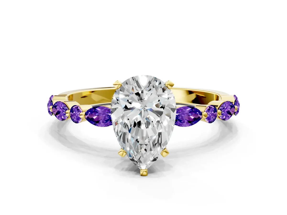 Pear Cut Diamond Ring with Marquise and Round Tanzanite Side Stones and Four-Prong Setting Yellow gold