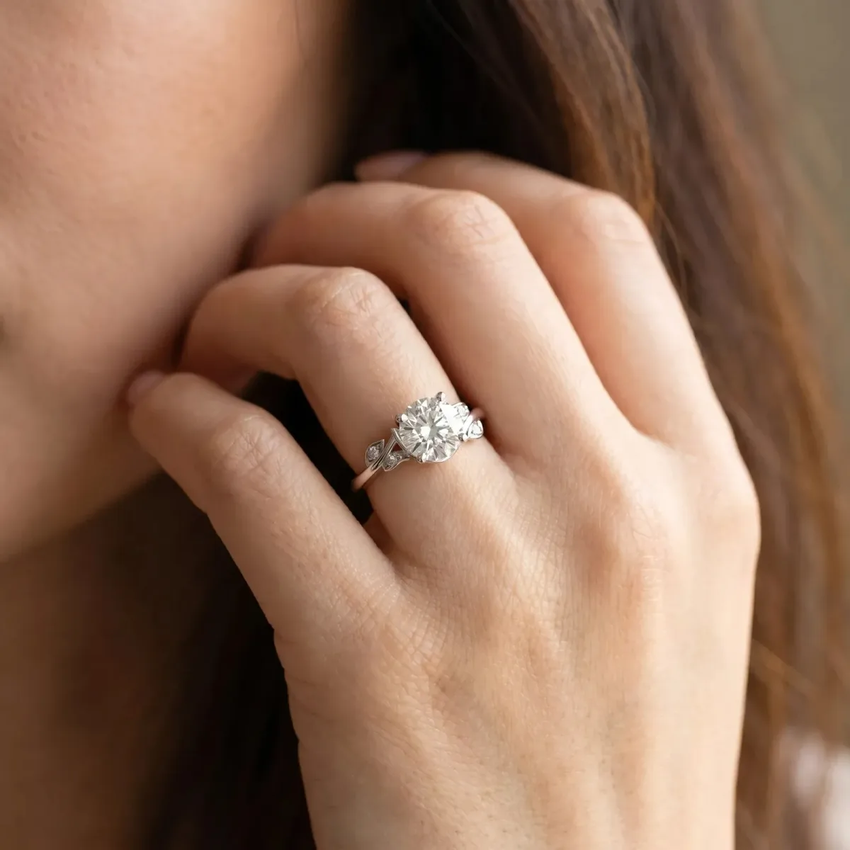 Princess Cut Solitaire Twist Engagement Ring with Leaf Accents and Prong Setting Silver