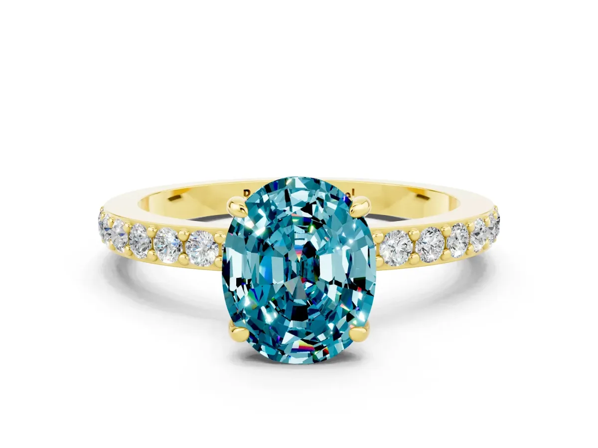 Oval Cut Blue Topaz Solitaire Engagement Ring with Pavé Band and Four-Prong Setting Yellow gold