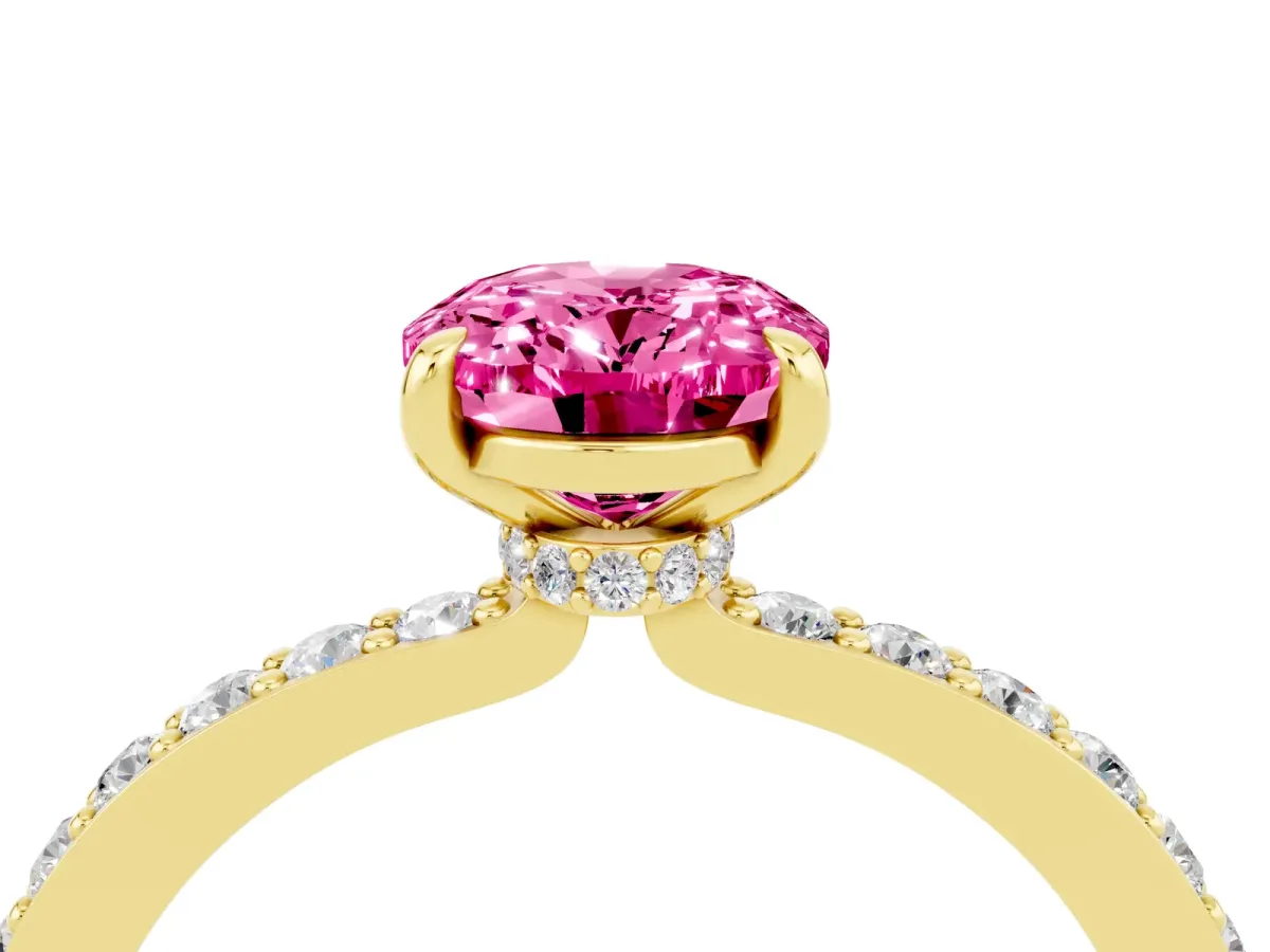 Oval Cut Pink Sapphire Solitaire Engagement Ring with Pavé Band and Four-Prong Setting Yellow gold