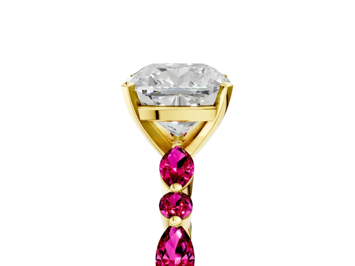 Cushion Cut Diamond Ring with Marquise and Round Garnet Side Stones and Four-Prong Setting Yellow gold