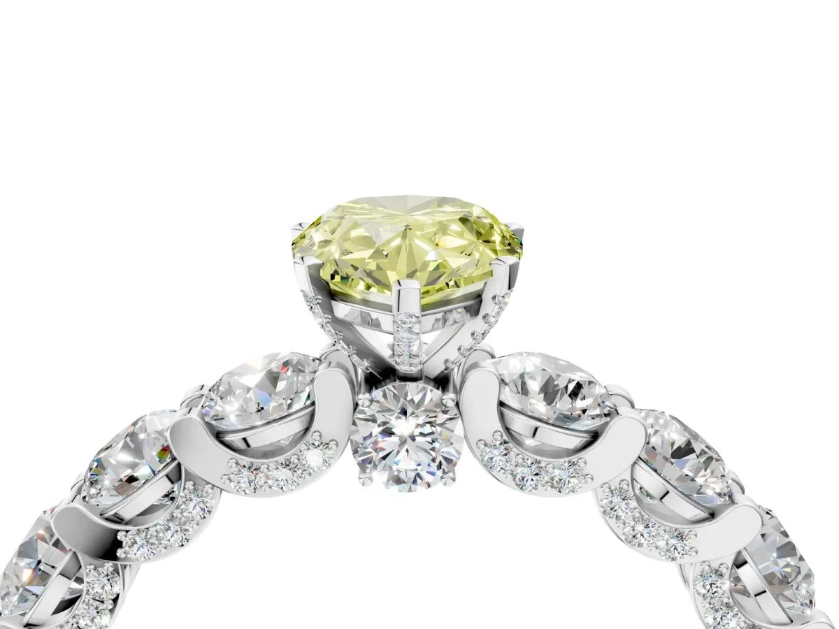 Fancy Yellow Pear Cut Diamond Side Stone Engagement Ring with Four-Prong Setting Platinum