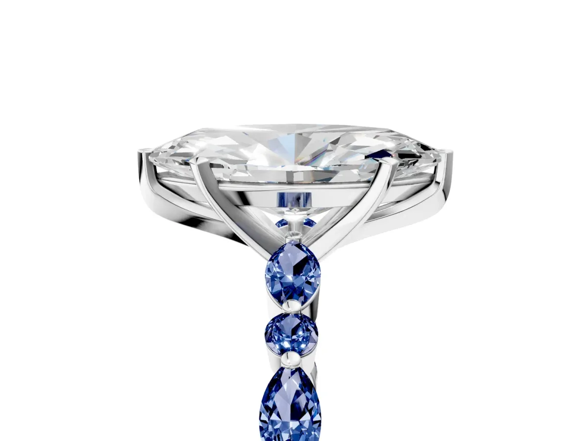 Marquise Cut Diamond Ring with Marquise and Round Blue Sapphire Side Stones and Four-Prong Setting Platinum
