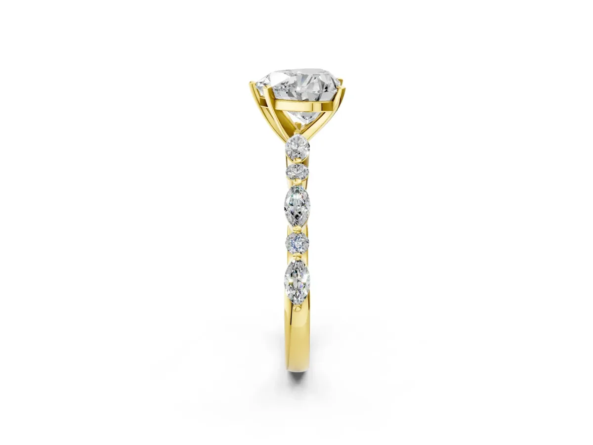 Heart Cut Diamond Ring with Marquise and Round Side Stones and Four-Prong Setting Yellow gold