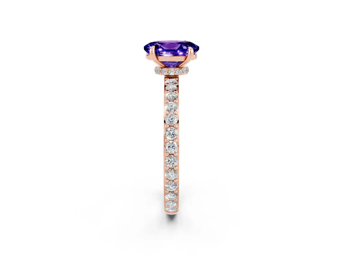 Oval Cut Tanzanite Solitaire Engagement Ring with Pavé Band and Four-Prong Setting Rose gold