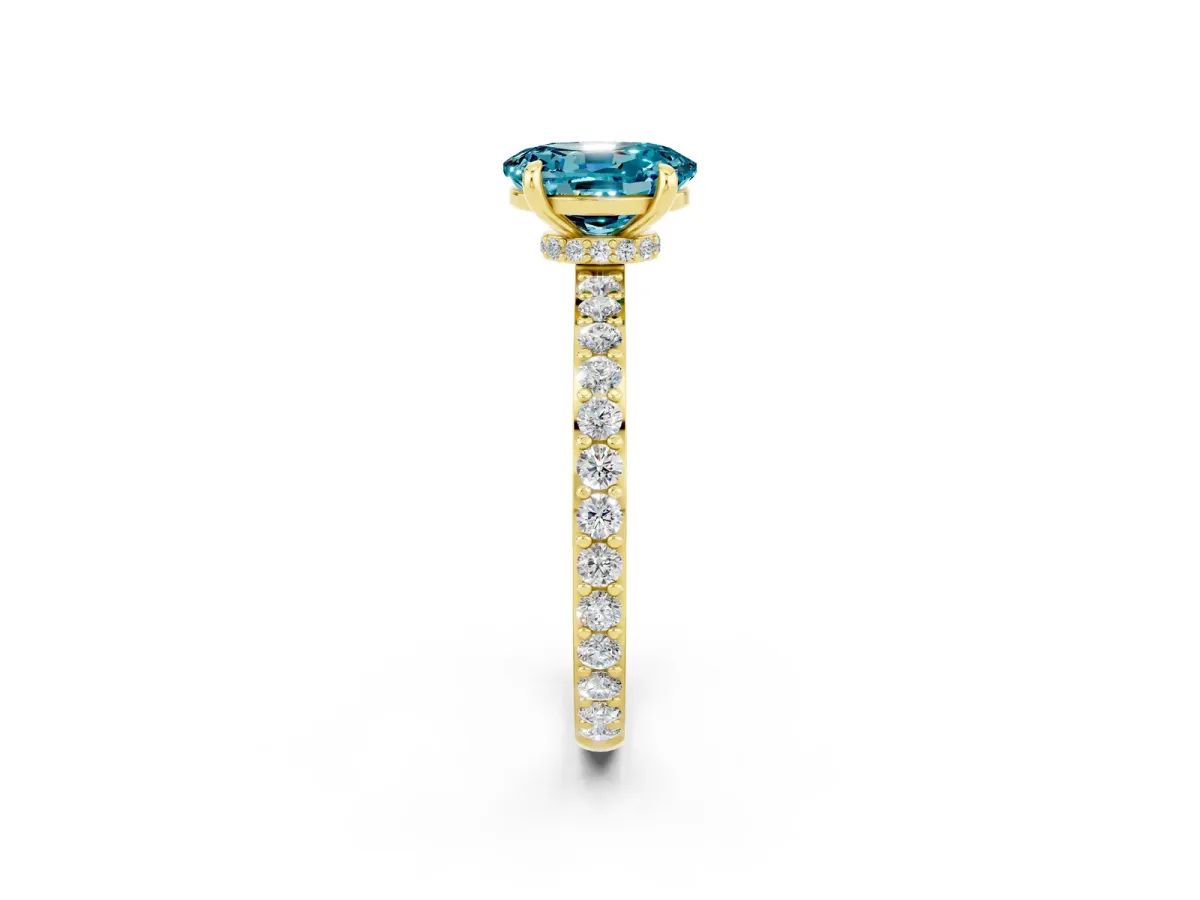 Oval Cut Blue Topaz Solitaire Engagement Ring with Pavé Band and Four-Prong Setting Yellow gold