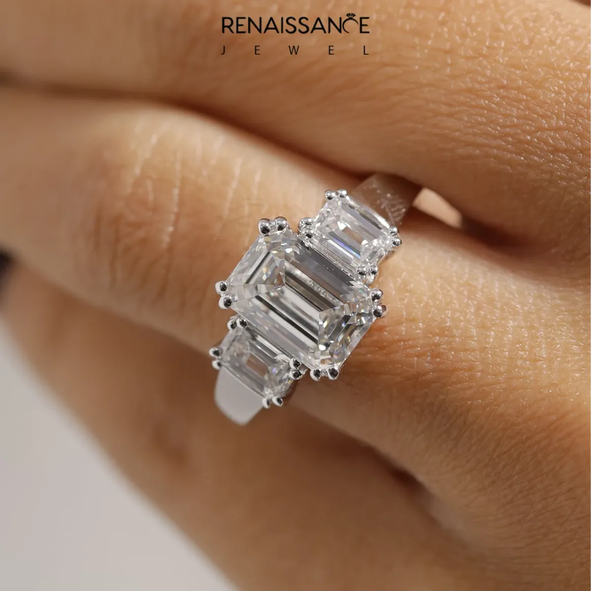 Three-Stone Emerald Cut Cut Diamond Ring with Channel Set Band and Four-Prong Setting Platinum