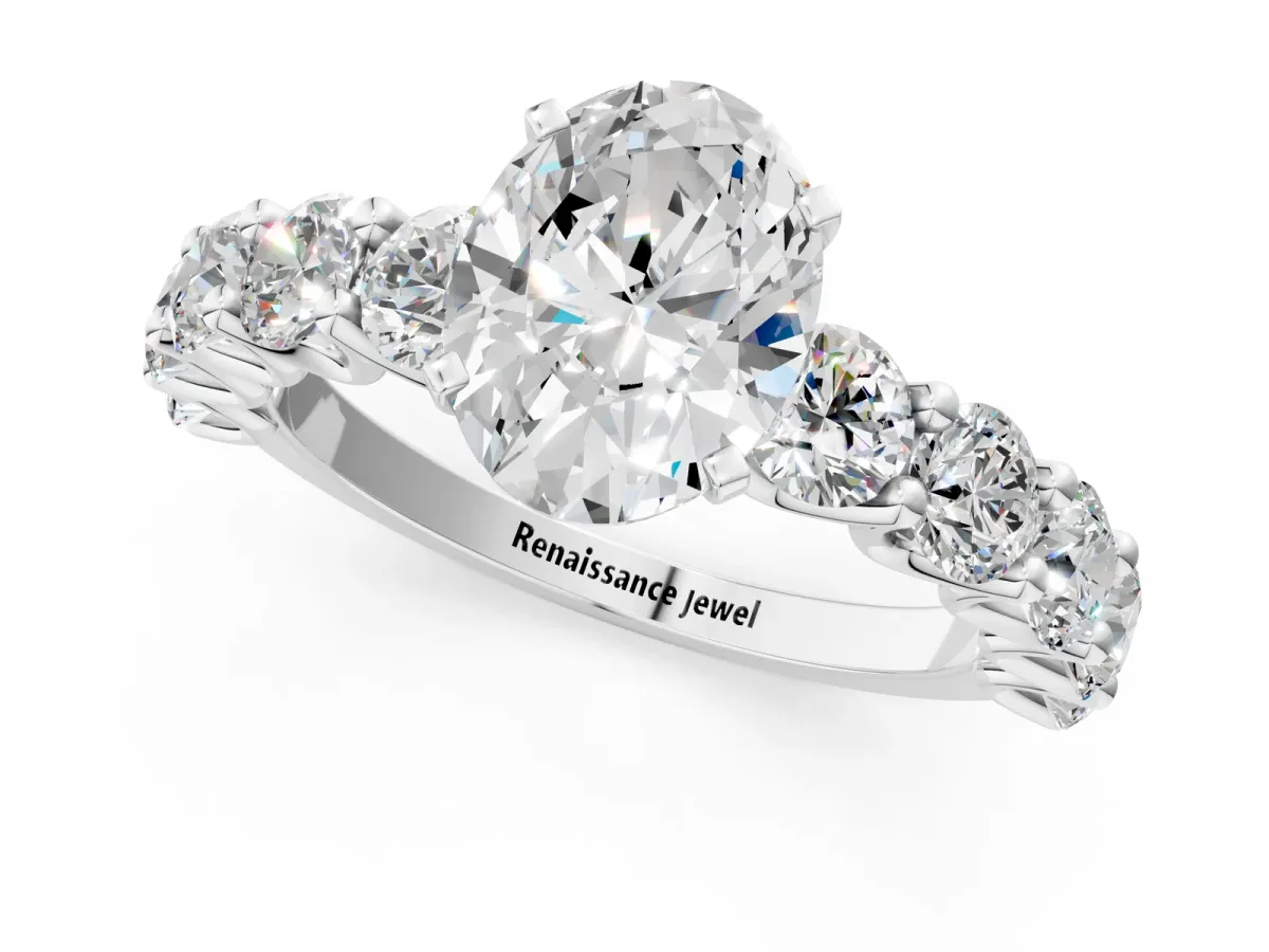 Oval Cut Diamond Prong Setting with Side Stones on a Pave Band Silver