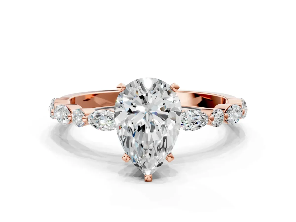 Pear Cut Diamond Ring with Marquise and Round Moissanite Side Stones and Four-Prong Setting Rose gold