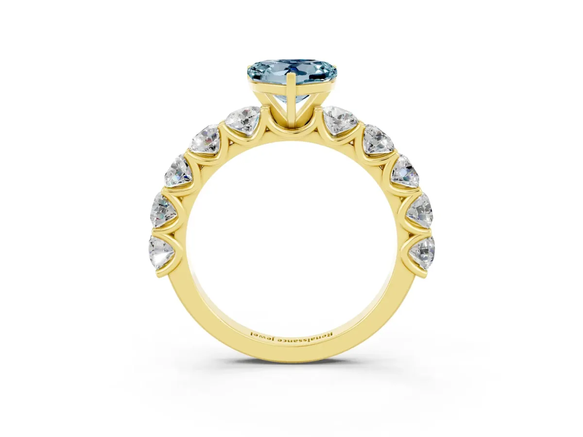 Heart Cut Aquamarine Prong Setting with Side Stones on a Pave Band Yellow gold