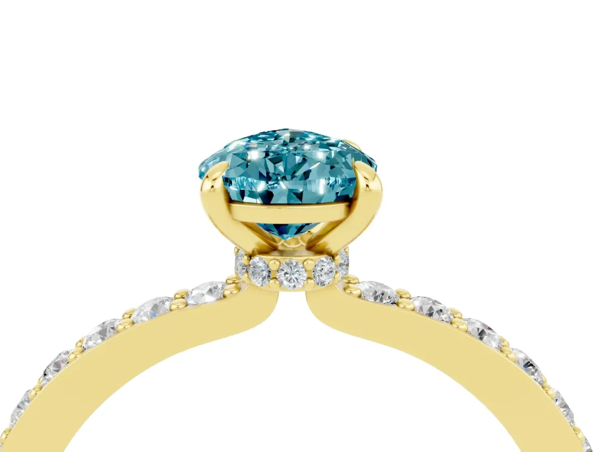 Pear Cut Blue Topaz Solitaire Engagement Ring with Pavé Band and Four-Prong Setting Yellow gold