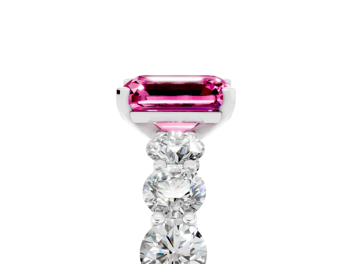 Emerald Cut Pink Sapphire Prong Setting with Side Stones on a Pave Band Silver