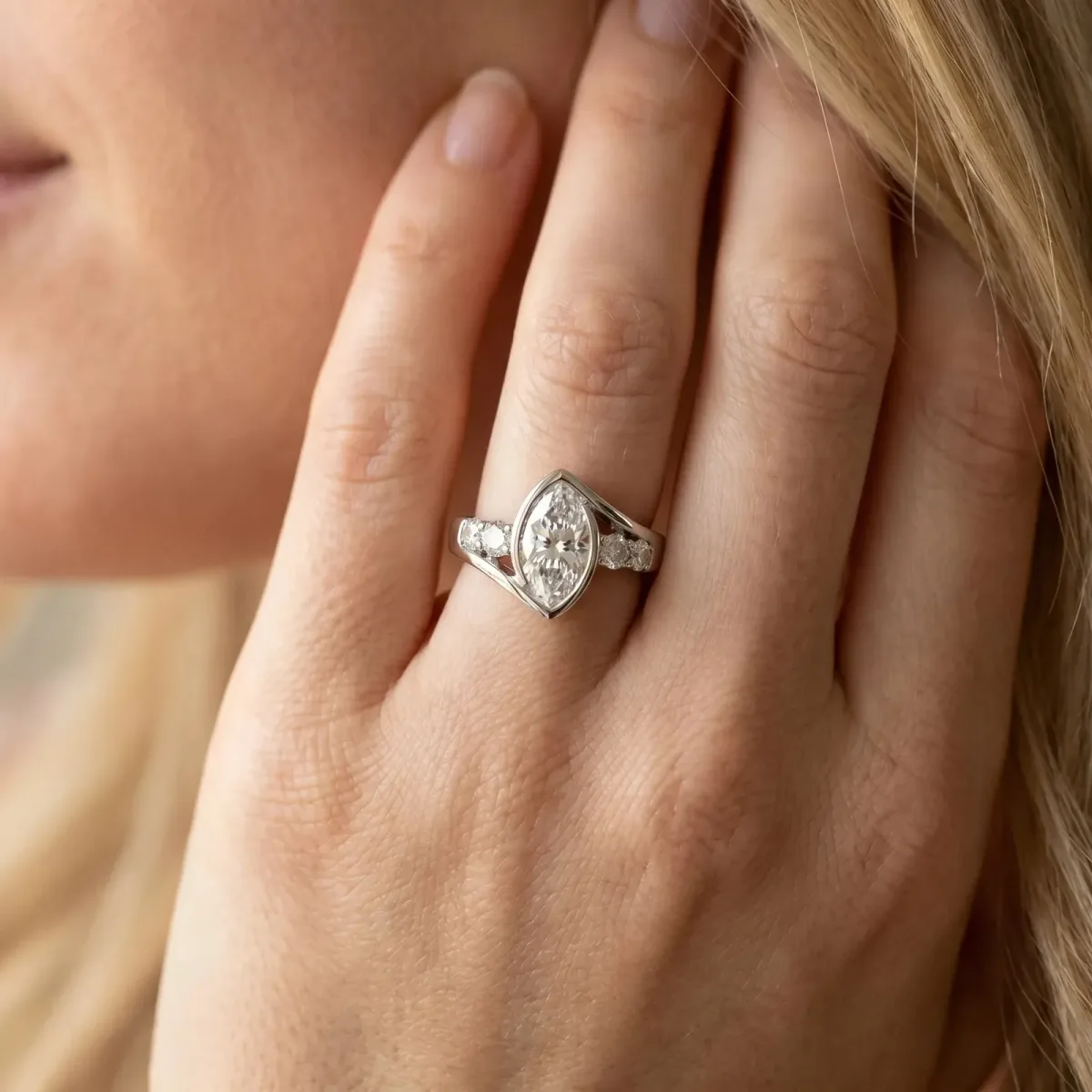 Bezel Set Marquise Cut Diamond Bypass Ring with Round Accents Platinum