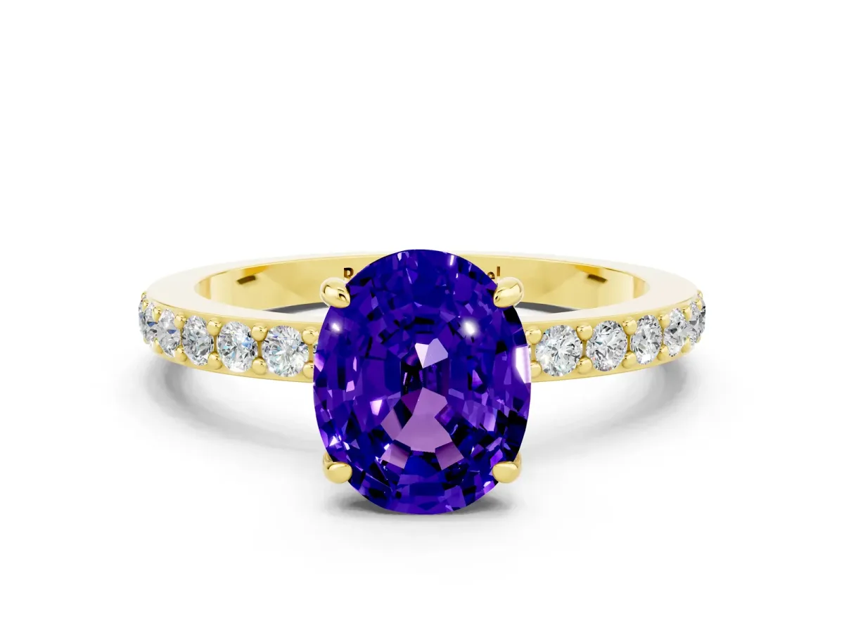 Oval Cut Tanzanite Solitaire Engagement Ring with Pavé Band and Four-Prong Setting Yellow gold