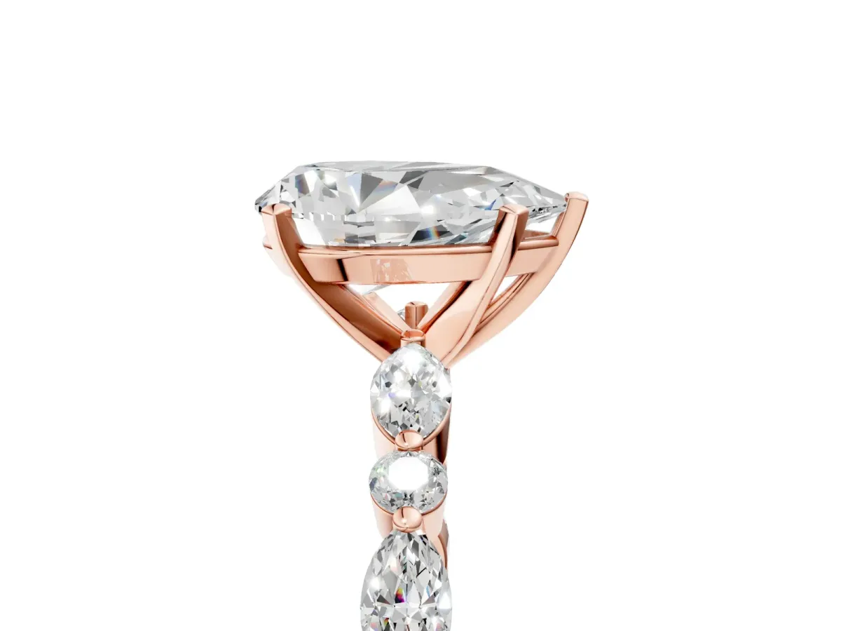 Pear Cut Diamond Ring with Marquise and Round Moissanite Side Stones and Four-Prong Setting Rose gold