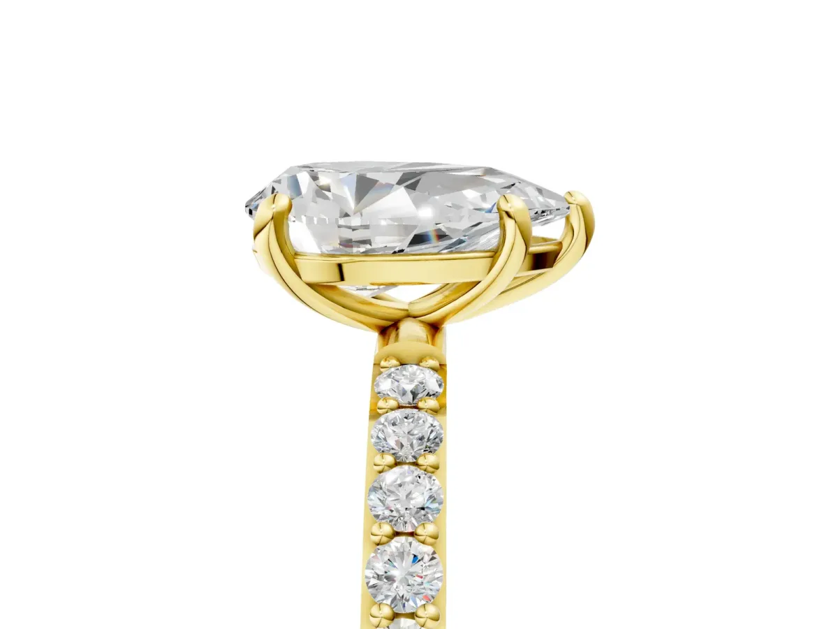 Pear Cut Diamond Solitaire Ring with Round Moissanite Pavé Band and Prong Setting Yellow gold