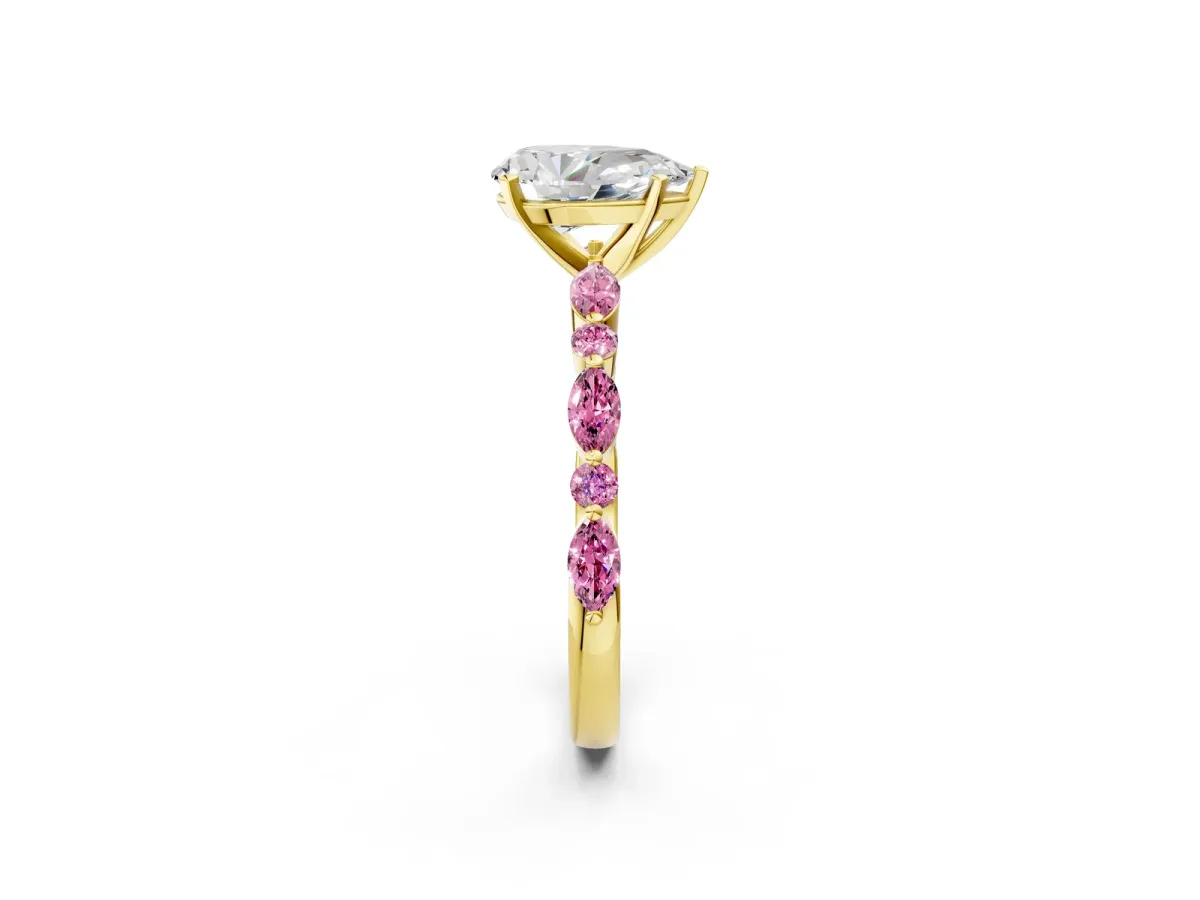 Pear Cut Diamond Ring with Marquise and Round Pink Sapphire Side Stones and Four-Prong Setting Yellow gold
