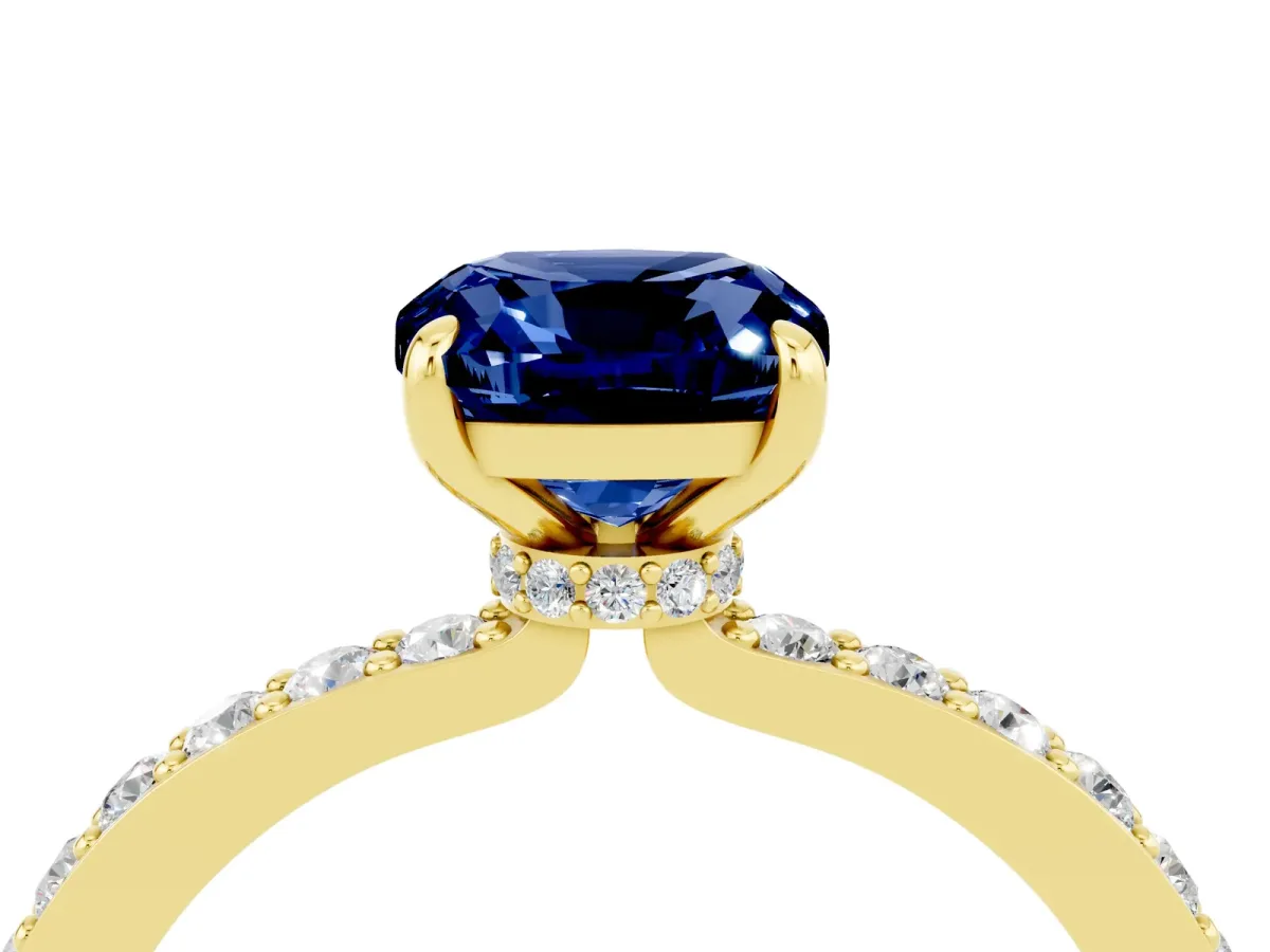 Cushion Cut Blue Sapphire Solitaire Engagement Ring with Pavé Band and Four-Prong Setting Yellow gold