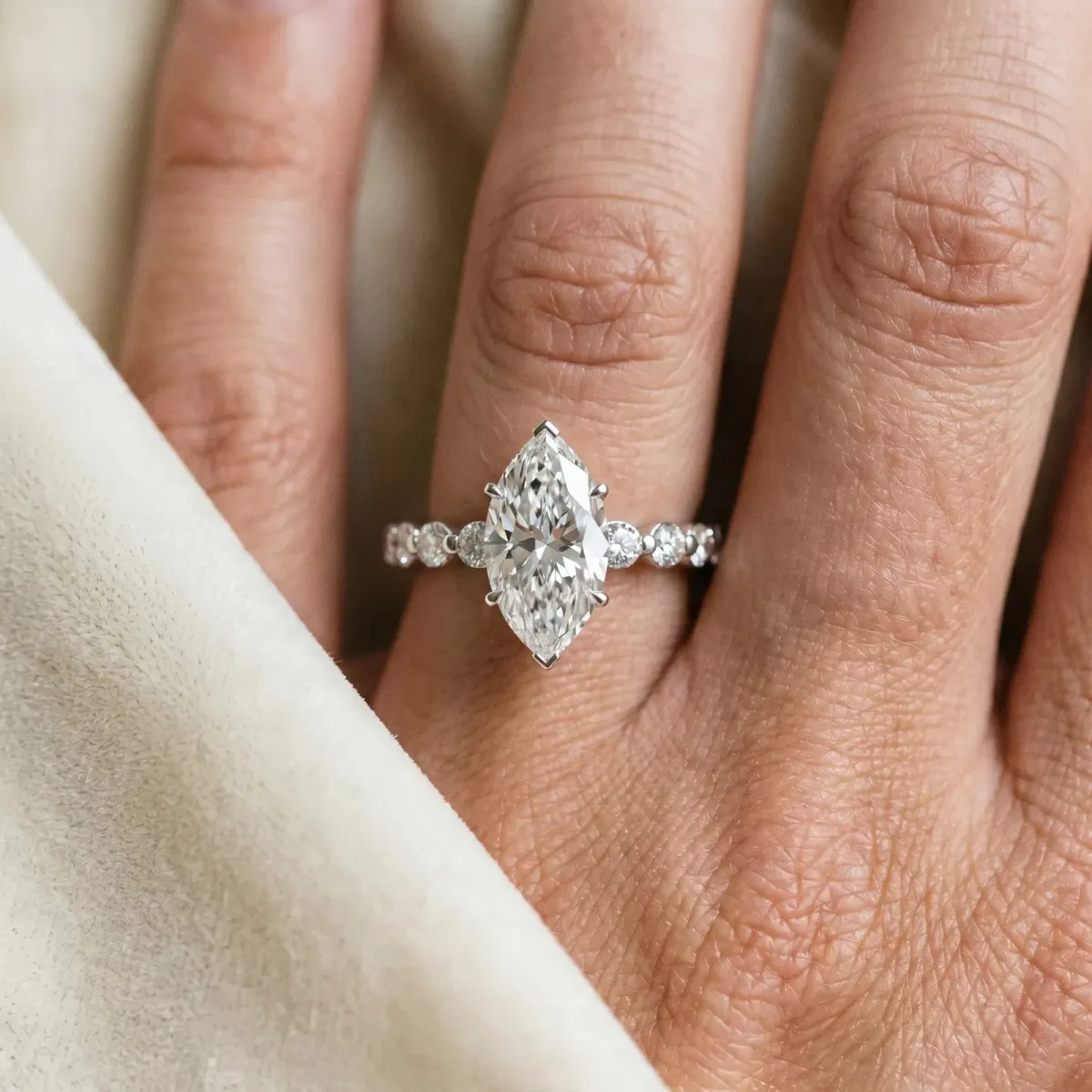 Marquise Cut Solitaire Diamond Ring with Pave Band and Four-Prong Setting Platinum